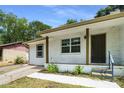 Inviting covered porch with white brick and wooden support beams at 2005 Simmons Ave, Atlanta, GA 30337