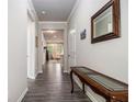 Inviting hallway featuring hardwood floors, neutral walls, and a view into the living area at 111 Point View Dr, Canton, GA 30114