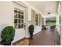 Covered front porch featuring seating area and charming architectural details at 1772 Ridgewood Ne Dr, Atlanta, GA 30307
