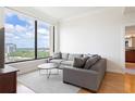 Comfortable living room with hardwood floors and a stunning city view at 3445 Stratford Ne Rd # 2409, Atlanta, GA 30326