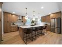 Spacious kitchen with stainless steel appliances, custom cabinets, a large island, and pendant lighting at 528 Pumpkinvine Rd, Acworth, GA 30101
