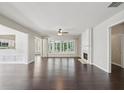 Bright living room with hardwood floors, fireplace, and plenty of natural light at 6755 Waveland Dr, Cumming, GA 30040
