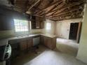 Spacious kitchen area with older cabinets and appliances, awaiting renovation and personalization at 2890 Bianca Ct, Decatur, GA 30034