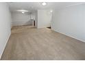 Spacious and light-filled living room with neutral carpeting and paint at 501 Vicksburg Pl, Atlanta, GA 30350