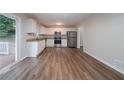 Bright kitchen features white cabinets, stainless steel appliances, and granite countertops at 1658 Pine Glen Cir, Decatur, GA 30035