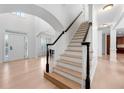 Elegant staircase with black handrail and white spindles at 1691 Holcomb Lake Rd, Marietta, GA 30062
