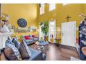 Open living space with hardwood floors, natural light, and comfortable seating arrangement at 176 Oak Green Dr, Lawrenceville, GA 30044