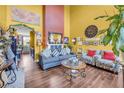 Bright living room featuring hardwood floors, high ceilings, stylish furnishings and decor at 176 Oak Green Dr, Lawrenceville, GA 30044
