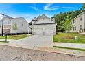 Beautiful two-story home showcasing a well-maintained lawn and modern design at 2703 Jordan Ln, Lithia Springs, GA 30122