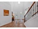 Bright foyer with high ceilings, stylish decor, and hardwood floors at 2703 Jordan Ln, Lithia Springs, GA 30122