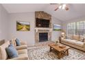 Inviting living room features stone fireplace, vaulted ceiling, and neutral decor at 8670 Brandon Hill Ln, Jonesboro, GA 30238