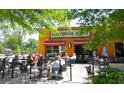 Outdoor patio seating with people dining at tables in front of a business at 106 Oakhurst Ter, Decatur, GA 30030