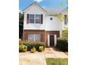 View of home showcasing the siding, brick, shutters and landscaping at 301 Brookview Dr, Riverdale, GA 30274