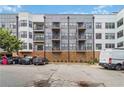 View of apartment building exterior showing parking and private balconies at 898 Oak Sw St # 3228, Atlanta, GA 30310