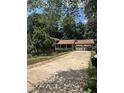 Two story home featuring an attached two-car garage and front porch at 504 Tracy Ct, Lawrenceville, GA 30046