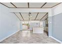 Living room with ceiling fan and bar area with view to the kitchen at 4235 Apache Se Dr, Acworth, GA 30102