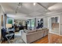 Comfortable living room showcases stylish decor, hardwood floors and natural light at 1530 Niskey Lake Sw Trl, Atlanta, GA 30331