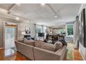 Bright and airy living room featuring hardwood floors, track lighting, and access to back deck at 1530 Niskey Lake Sw Trl, Atlanta, GA 30331
