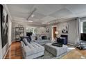 Open living space featuring hardwood floors, neutral paint, and plenty of seating at 1530 Niskey Lake Sw Trl, Atlanta, GA 30331