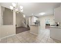 Open-concept kitchen with granite counters, stainless appliances, and easy access to the living area at 2004 Township Dr, Woodstock, GA 30189