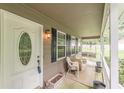 Inviting porch with seating area, ideal for relaxing and enjoying the outdoors at 4411 Westerling Ct, Powder Springs, GA 30127