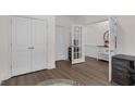 Home office with hardwood floors, white trim, double closet and french door at 935 Grove Valley Drive Dr, Cumming, GA 30041