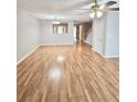 Open living space with hardwood floors, a ceiling fan, and access to other rooms, creating a welcoming atmosphere at 3948 Oak Glenn Dr, Duluth, GA 30096