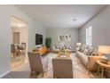 Stylishly furnished living room with contemporary decor, plush seating, and ample natural light at 502 Snowfall Ter, Palmetto, GA 30268