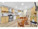 Well-lit kitchen featuring stainless steel appliances, stylish countertops, and wood-look vinyl flooring at 288 Valerie Cir, Hiram, GA 30141
