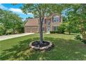 Beautiful home with lush green lawn, mature landscaping, and a spacious driveway at 1002 Hallman Sw Ter, Marietta, GA 30064
