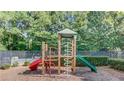 Community playground featuring a slide and climbing structure at 3485 Parkbrooke Ln, Duluth, GA 30096