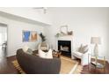 Bright living room featuring a fireplace, modern decor, and hardwood flooring throughout at 1334 Gates Se Dr, Atlanta, GA 30316