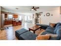 Spacious living room featuring hardwood floors, comfortable seating and an open floorplan at 1574 Leonard St, Hampton, GA 30228