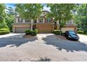 Townhome with a two-car garage, manicured front yard, and inviting curb appeal at 4349 Kousa Rd # 4, Austell, GA 30106