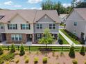 Attractive townhouse with landscaping, fenced yard, and brick and siding facade at 6761 Cedar Glen Rd, Peachtree Corners, GA 30360