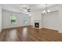 Bright living room showcasing hardwood floors, fireplace, and natural light at 6761 Cedar Glen Rd, Peachtree Corners, GA 30360