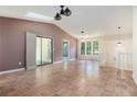 Spacious living room features ceramic tile floors, high vaulted ceiling, and sliding glass door access to the deck at 1180 Springs Dr, Canton, GA 30115