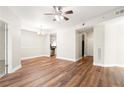 Open-concept living space with updated flooring and a view of the adjacent kitchen and dining area at 230 E Ponce De Leon Ave # 104, Decatur, GA 30030