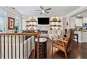 Cozy living room featuring a fireplace, built-in shelving, comfortable seating and hardwood floors, adding warmth at 2520 Carmel Way, Alpharetta, GA 30009