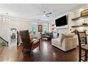 Stylish living room with hardwood floors, modern lighting, a fireplace, and balcony access creating a cozy ambiance at 2520 Carmel Way, Alpharetta, GA 30009