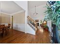 Inviting foyer with hardwood floors offering views to the dining room and living room at 7198 Golfside Se Dr, Covington, GA 30014