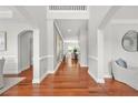 Inviting foyer with gleaming hardwood floors, neutral paint, and arched doorways for an elegant entrance at 2241 Chaseford Ln, Powder Springs, GA 30127