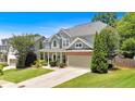 Attractive two-story home with a well-kept lawn, covered porch, and an attached two-car garage at 204 Sawtooth Ct, Canton, GA 30114