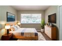 Serene bedroom with a queen-sized bed, ample natural light, and modern decor at 3904 W Hilda Cir, Decatur, GA 30035
