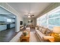 A cozy living room features neutral tones, hardwood floors, and a large window for natural light at 3904 W Hilda Cir, Decatur, GA 30035