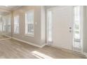 Bright and airy foyer with light wood floors, a large front door and lots of natural light at 1029 Chaterly Ct, Riverdale, GA 30296
