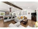 Spacious open-concept living area with a kitchen island, seamlessly blending modern style and comfort at 6875 Sunny Brook Lane Northeast, Sandy Springs, GA 30328
