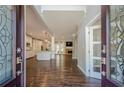 Inviting foyer with hardwood floors and an open floor plan, showcasing the kitchen and living spaces at 875 Soaring Cir, Marietta, GA 30062