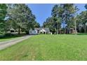 This home is on a spacious lot with mature trees and a well-manicured front lawn at 969 Bob Hannah Cir, Lawrenceville, GA 30044