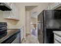 Practical kitchen featuring white cabinets, and neutral flooring at 1060 Heatherwood Ct, Norcross, GA 30093